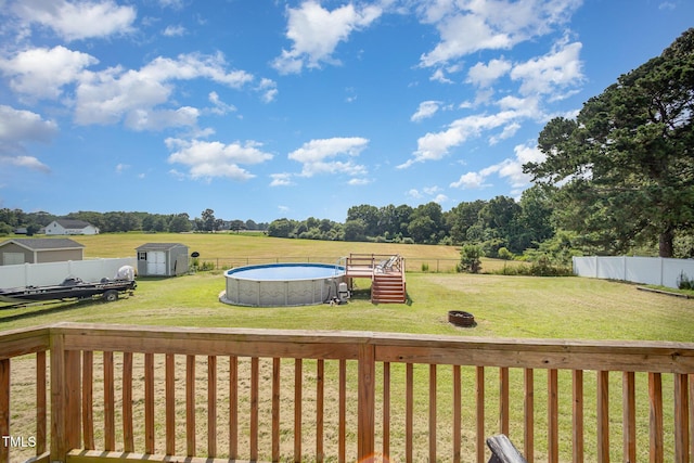 141 Vibernum Vw, Four Oaks, NC 27524 - wooden deck with a shed, a fenced backyard, and a view of rural / pastoral area