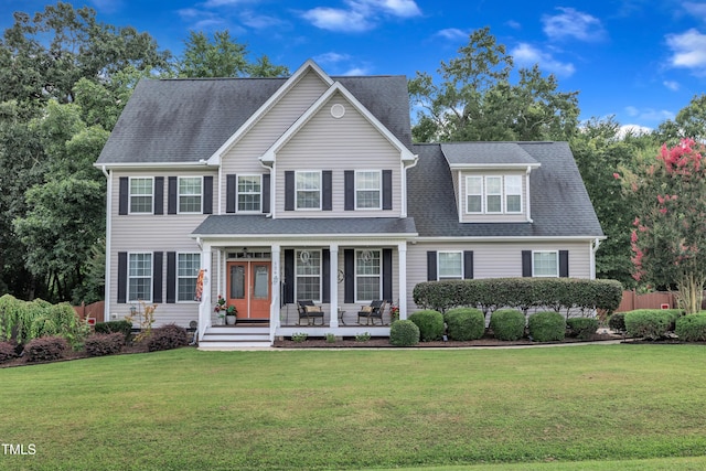 126 Gwendolyn Way, Fuquay Varina, NC 27526 - view of front facade with covered porch, a front lawn, and roof with shingles