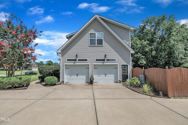 126 Gwendolyn Way, Fuquay Varina, NC 27526 - view of property exterior with an attached garage, driveway, and a gate