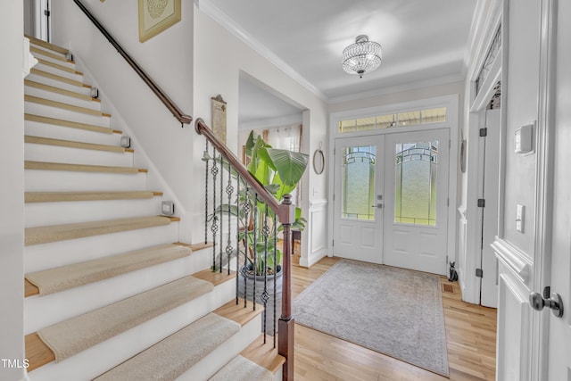 126 Gwendolyn Way, Fuquay Varina, NC 27526 - entrance foyer featuring crown molding, wood finished floors, stairs, and a chandelier
