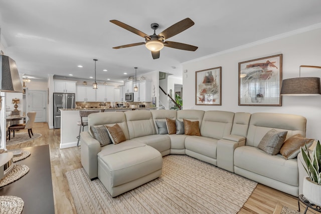 126 Gwendolyn Way, Fuquay Varina, NC 27526 - living area with a ceiling fan, light wood-style floors, ornamental molding, recessed lighting, and stairway