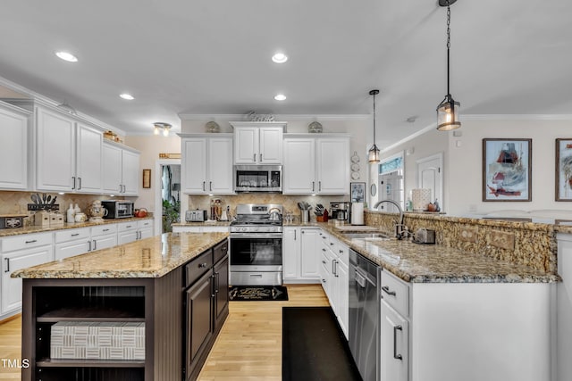 126 Gwendolyn Way, Fuquay Varina, NC 27526 - kitchen featuring stainless steel appliances, white cabinets, crown molding, and recessed lighting