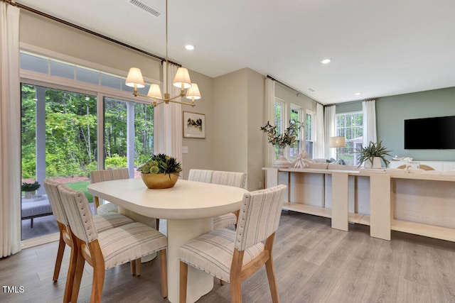 3010 Shady Sage Way Lot 15, Apex, NC 27523 - dining area with a chandelier, wood finished floors, and recessed lighting