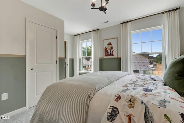 3010 Shady Sage Way Lot 15, Apex, NC 27523 - bedroom featuring carpet floors and a chandelier