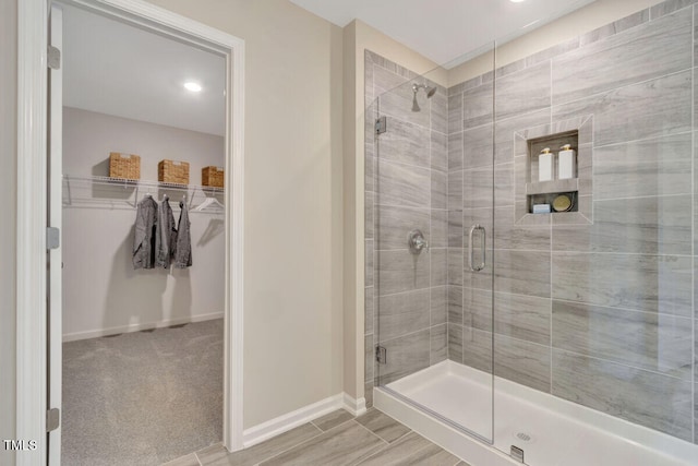 3010 Shady Sage Way Lot 15, Apex, NC 27523 - bathroom with a shower stall and a walk in closet
