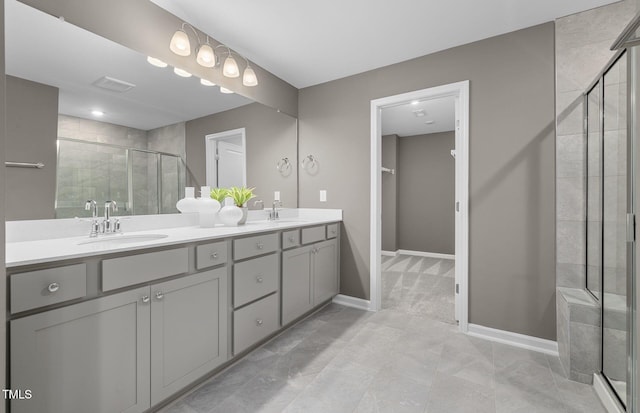 1001 Jensen Rd, Durham, NC 27703 - full bathroom featuring a shower stall, double vanity, and a walk in closet