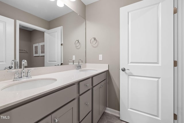 1001 Jensen Rd, Durham, NC 27703 - bathroom featuring double vanity and baseboards
