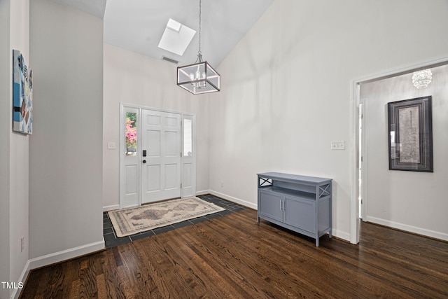 316 Boltstone Ct, Cary, NC 27513 - foyer with a chandelier, high vaulted ceiling, dark wood finished floors, and a skylight