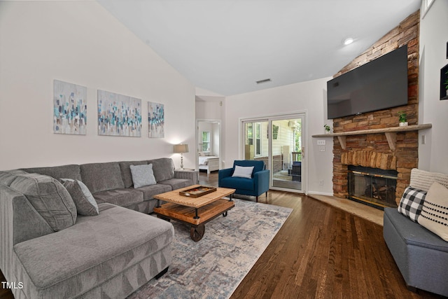 316 Boltstone Ct, Cary, NC 27513 - living room with lofted ceiling, wood finished floors, and a fireplace