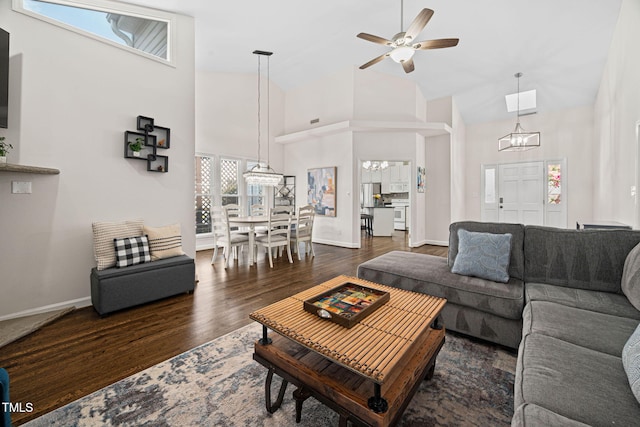 316 Boltstone Ct, Cary, NC 27513 - living area featuring high vaulted ceiling, a chandelier, wood finished floors, and a ceiling fan