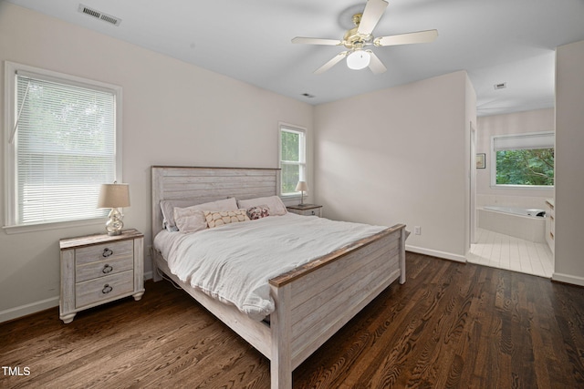 316 Boltstone Ct, Cary, NC 27513 - bedroom featuring multiple windows, dark wood-style flooring, a ceiling fan, and connected bathroom