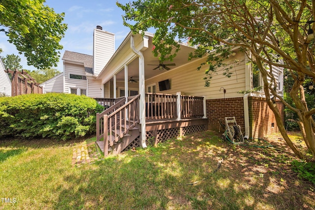 316 Boltstone Ct, Cary, NC 27513 - back of house featuring a ceiling fan, a chimney, brick siding, a deck, and a yard
