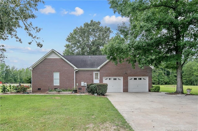 7655 Lucinda Ln, Linden, NC 28356 - view of front of home with brick siding, an attached garage, concrete driveway, and a front lawn