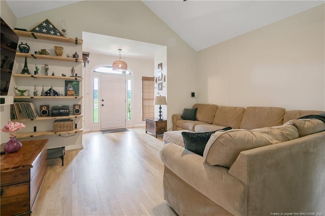 7655 Lucinda Ln, Linden, NC 28356 - living room featuring vaulted ceiling and wood finished floors