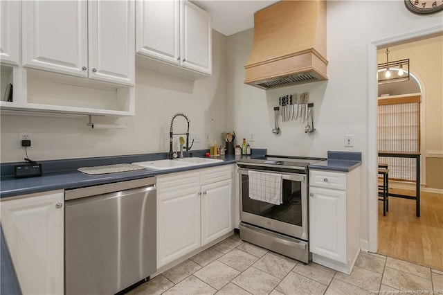7655 Lucinda Ln, Linden, NC 28356 - kitchen featuring appliances with stainless steel finishes, custom exhaust hood, open shelves, and white cabinetry