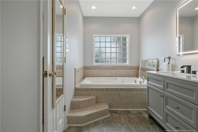 7655 Lucinda Ln, Linden, NC 28356 - full bathroom featuring vanity, a garden tub, wood finished floors, and recessed lighting