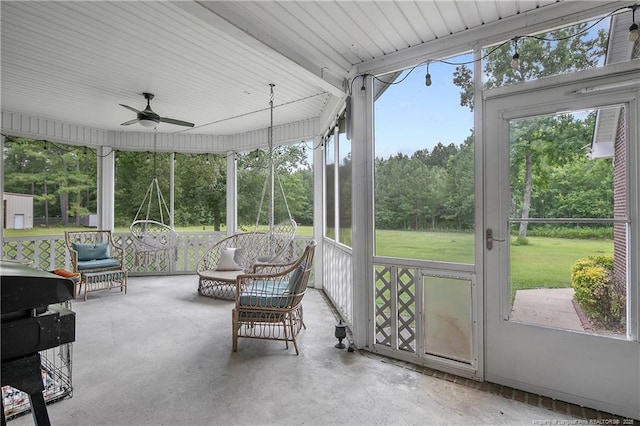7655 Lucinda Ln, Linden, NC 28356 - sunroom / solarium featuring ceiling fan and view of scattered trees