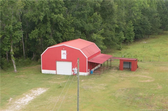 7655 Lucinda Ln, Linden, NC 28356 - view of pole building with dirt driveway and a yard