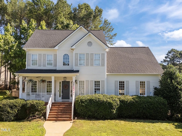 513 Moultonboro Ave, Wake Forest, NC 27587 - view of front of house featuring a porch, a front lawn, and roof with shingles