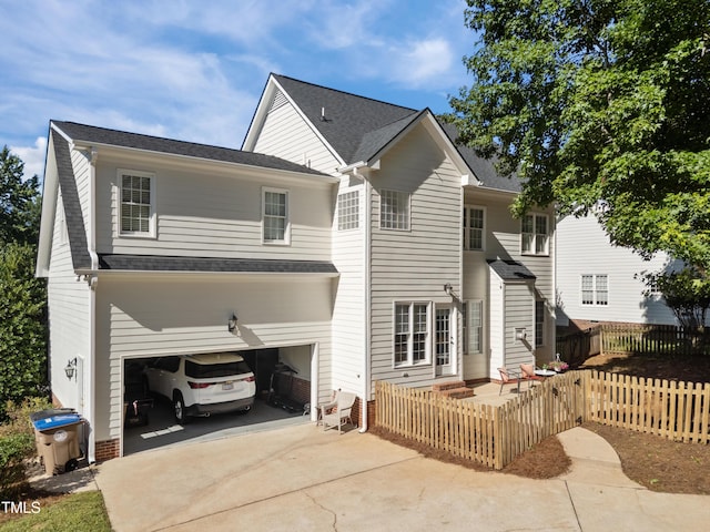 513 Moultonboro Ave, Wake Forest, NC 27587 - rear view of house featuring concrete driveway and a garage