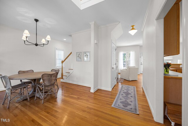 513 Moultonboro Ave, Wake Forest, NC 27587 - dining area featuring a chandelier, stairway, light wood-style floors, and recessed lighting