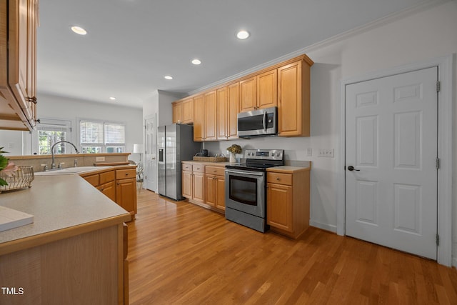 513 Moultonboro Ave, Wake Forest, NC 27587 - kitchen with appliances with stainless steel finishes, light wood-style floors, recessed lighting, light countertops, and a peninsula