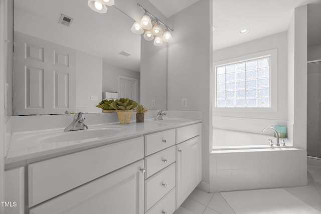 513 Moultonboro Ave, Wake Forest, NC 27587 - bathroom featuring double vanity, a garden tub, and tile patterned floors