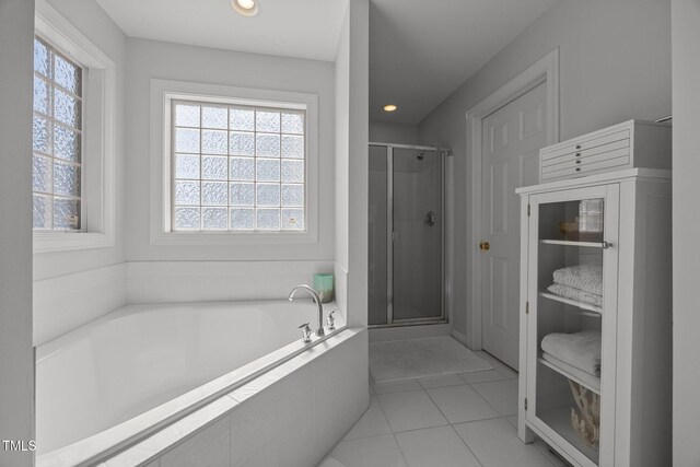513 Moultonboro Ave, Wake Forest, NC 27587 - bathroom featuring a garden tub, a stall shower, tile patterned flooring, and recessed lighting