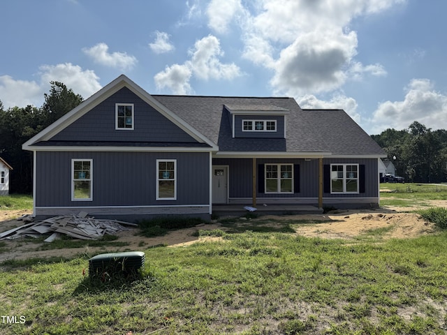 604 Tuscany Cir, Princeton, NC 27569 - view of front of house featuring covered porch, a front yard, and roof with shingles