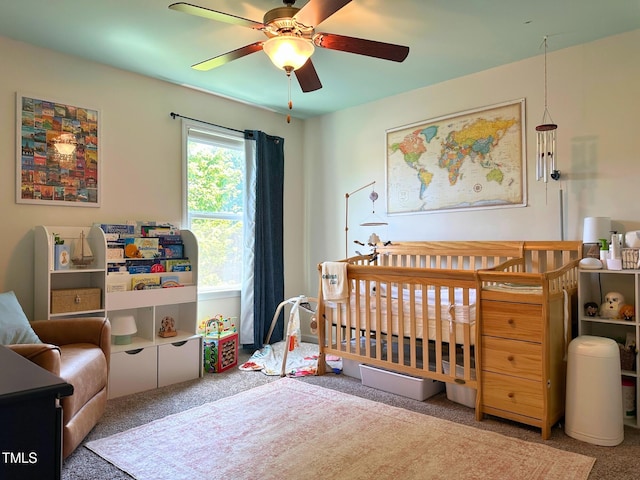 505 Poplar St, Durham, NC 27703 - carpeted bedroom with a nursery area and a ceiling fan