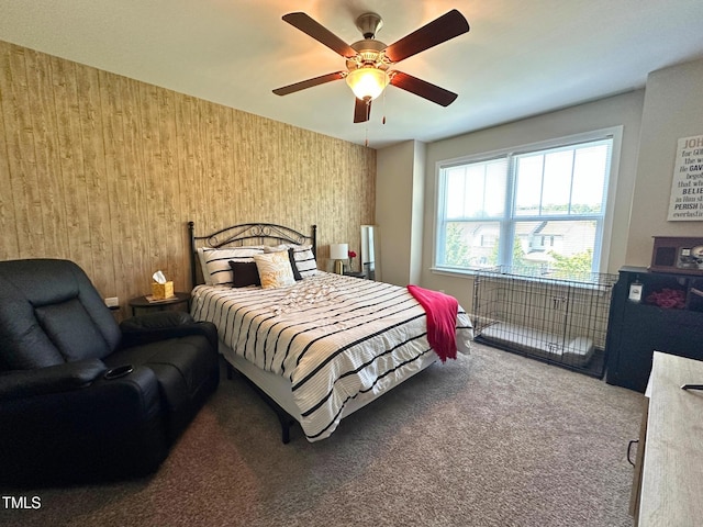 505 Poplar St, Durham, NC 27703 - bedroom featuring carpet flooring, a ceiling fan, and wood walls
