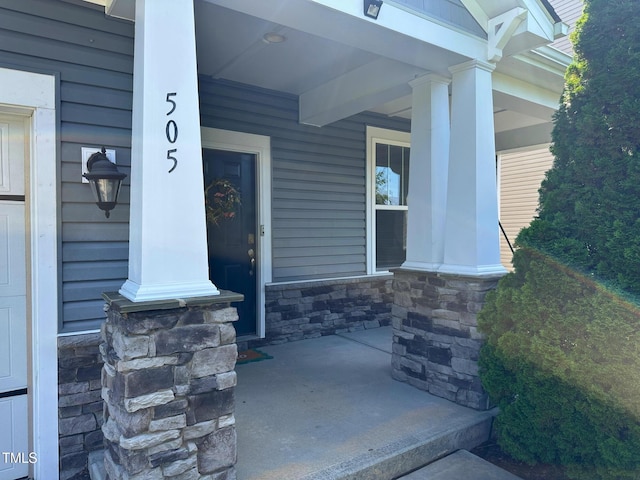 505 Poplar St, Durham, NC 27703 - property entrance featuring a porch and stone siding