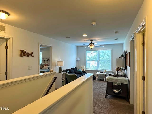 505 Poplar St, Durham, NC 27703 - corridor featuring dark colored carpet, an upstairs landing, and recessed lighting
