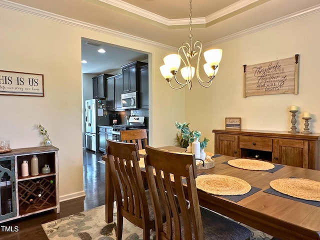 505 Poplar St, Durham, NC 27703 - dining room featuring dark wood finished floors, a chandelier, crown molding, a raised ceiling, and recessed lighting