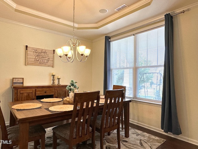 505 Poplar St, Durham, NC 27703 - dining area with a tray ceiling, a chandelier, wood finished floors, and crown molding