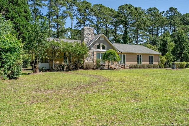 116 Bledsoe St, Hope Mills, NC 28348 - view of front of property featuring a chimney and a front yard