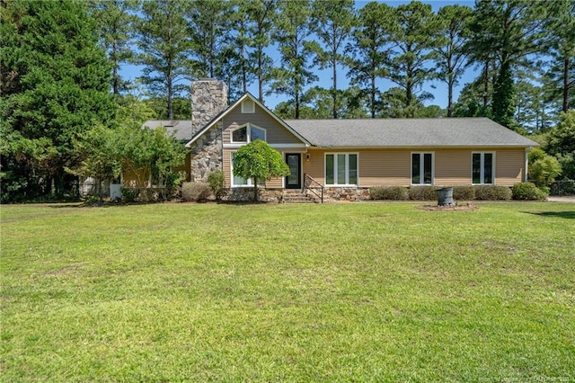116 Bledsoe St, Hope Mills, NC 28348 - view of front facade with a chimney, stone siding, and a front lawn