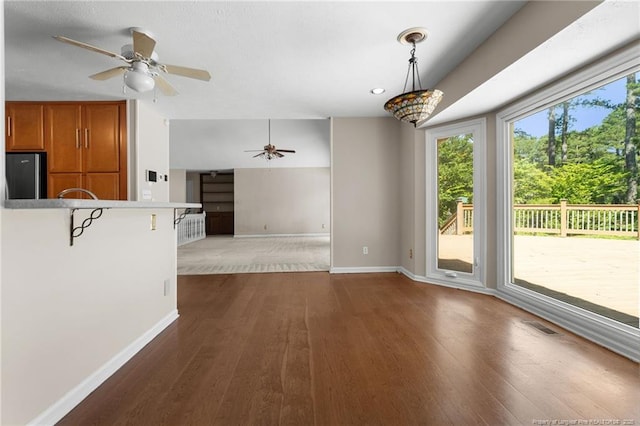 116 Bledsoe St, Hope Mills, NC 28348 - unfurnished living room featuring a ceiling fan and dark wood-type flooring