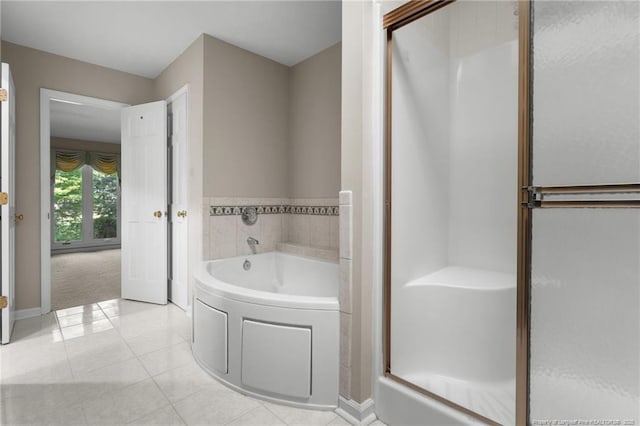 116 Bledsoe St, Hope Mills, NC 28348 - bathroom featuring a garden tub, a stall shower, and tile patterned flooring