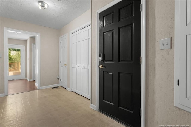 116 Bledsoe St, Hope Mills, NC 28348 - entryway with a textured ceiling and light flooring