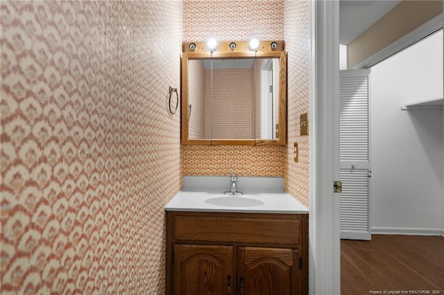 116 Bledsoe St, Hope Mills, NC 28348 - bathroom featuring wallpapered walls, vanity, and wood finished floors