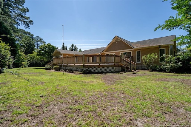 116 Bledsoe St, Hope Mills, NC 28348 - rear view of property featuring a wooden deck and a lawn