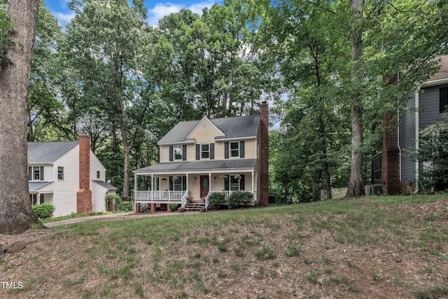350 Amherst Creek Dr, Wake Forest, NC 27587 - colonial house with a porch, a chimney, and a front lawn