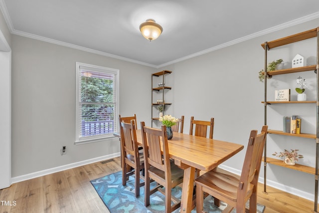 350 Amherst Creek Dr, Wake Forest, NC 27587 - dining space featuring light wood-style floors and ornamental molding