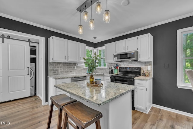 350 Amherst Creek Dr, Wake Forest, NC 27587 - kitchen featuring stainless steel appliances, light wood-style floors, white cabinets, and ornamental molding