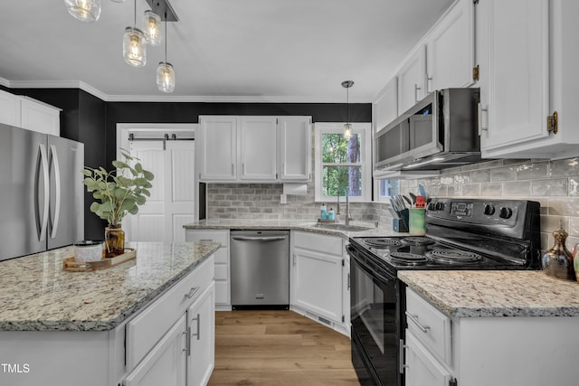 350 Amherst Creek Dr, Wake Forest, NC 27587 - kitchen with appliances with stainless steel finishes, white cabinets, light wood-type flooring, tasteful backsplash, and decorative light fixtures