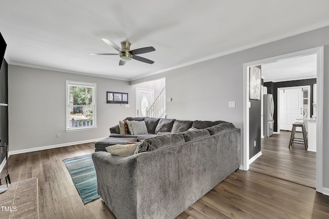 350 Amherst Creek Dr, Wake Forest, NC 27587 - living area with ceiling fan, stairway, crown molding, and dark wood finished floors