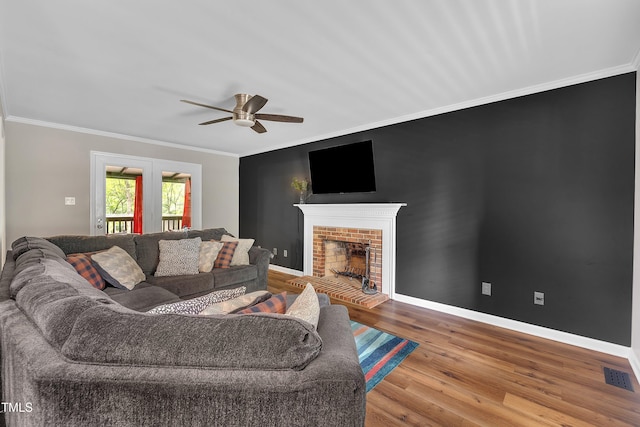 350 Amherst Creek Dr, Wake Forest, NC 27587 - living area with ceiling fan, wood finished floors, crown molding, and a fireplace