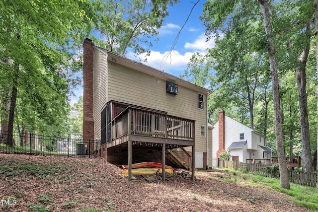 350 Amherst Creek Dr, Wake Forest, NC 27587 - rear view of property featuring a chimney, a wooden deck, and stairs