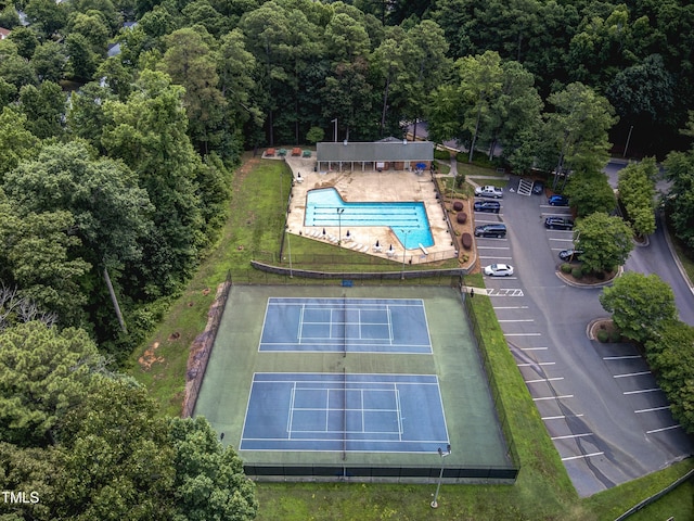 350 Amherst Creek Dr, Wake Forest, NC 27587 - aerial view of property and surrounding area featuring a pool and a heavily wooded area